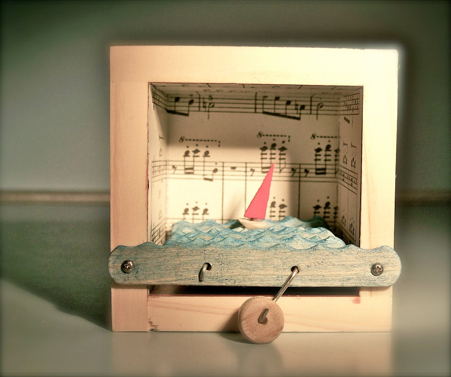 sailboat automaton in music note box