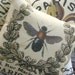 French Inspired Garland Crested BEE PILLOW in shades of Gold and Black with a Cream Linen Envelope Closure Back