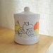 ceramic kitchen canister with mod fruit graphics
