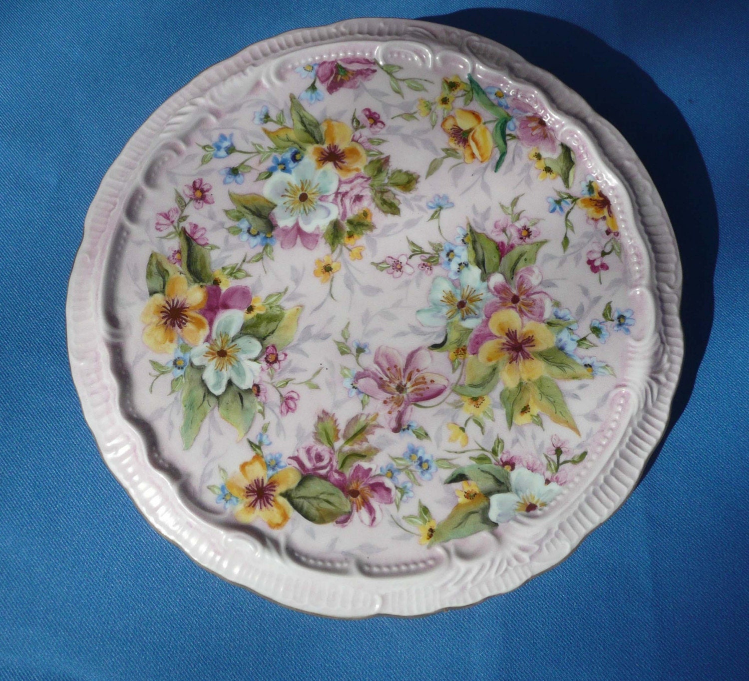 Yellow and White Flowers on a Trivet Hot Plate
