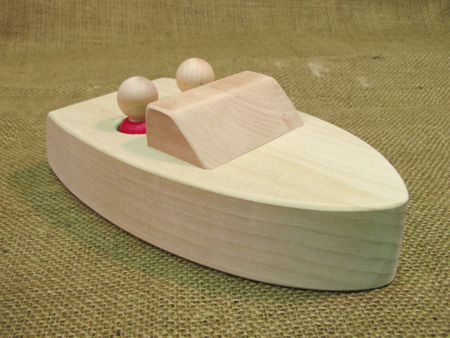 Floating wooden boat toy