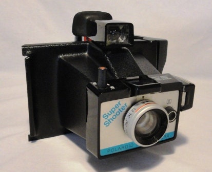 Vintage Camera . Polaroid Land Camera Super Shooter