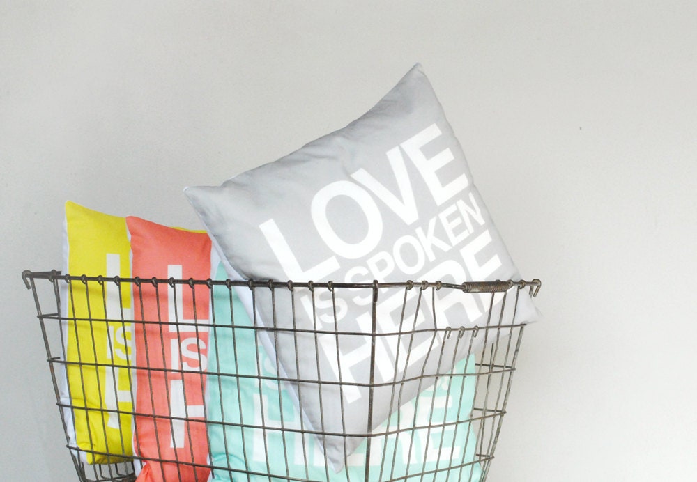 Love is Spoken Here 14"x14" pillow in coral pink