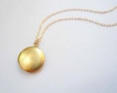 Small gold locket necklace on 14K gold fill GF chain. Dainty jewelry. Vintage round brass locket on short necklace chain.