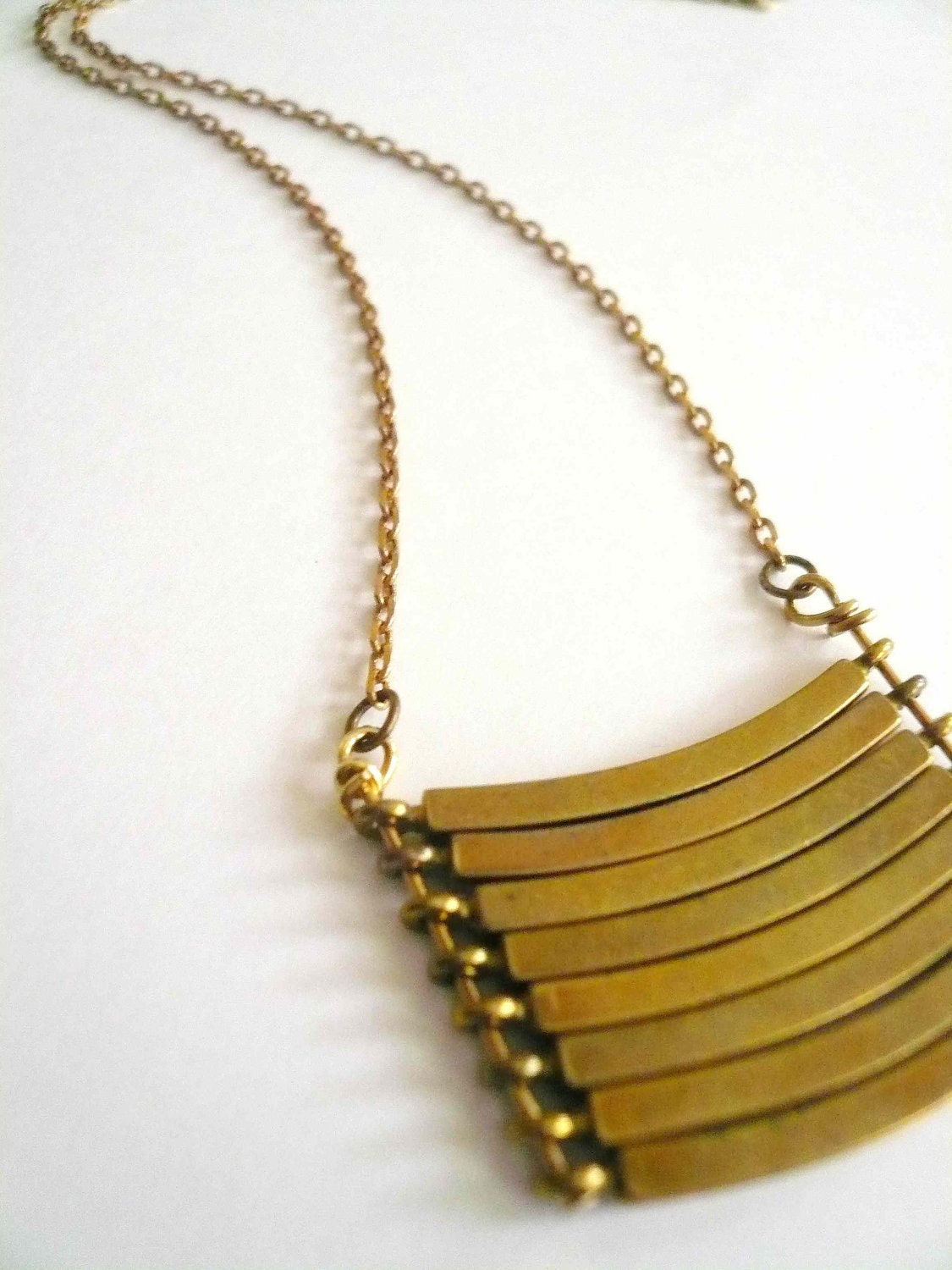 Brass geometric necklace with military style curved brass bars. Stacked bar necklace.