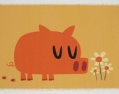 Pig smelling flowers