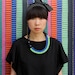 The Celeste asymmetrical woven beaded necklace in spring green / blue