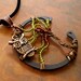 Who is There a  Wire Tree with Brass Owl Industrial Necklace