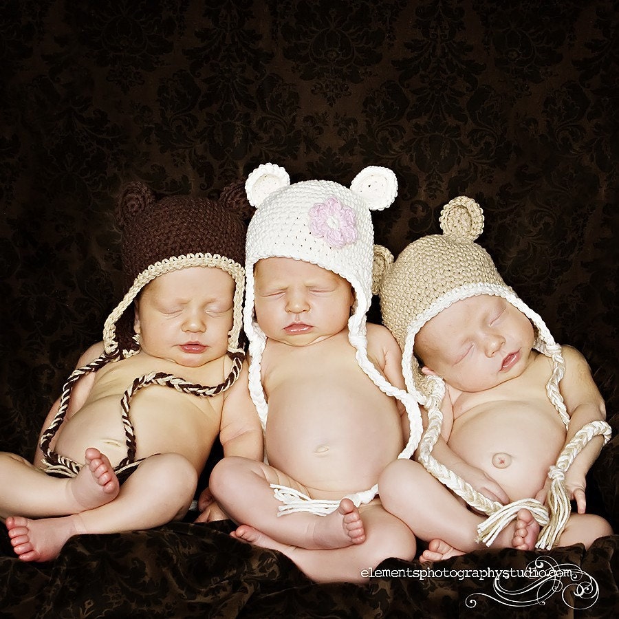 12-24 month cream bear hat with earflaps and a pink flower