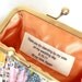 Custom message on a wide satin ribbon for your clutch