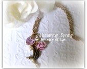 Humming Spring Necklace made with humming bird charm, swarovski heart crystal, swarovski pearl, flower etc.