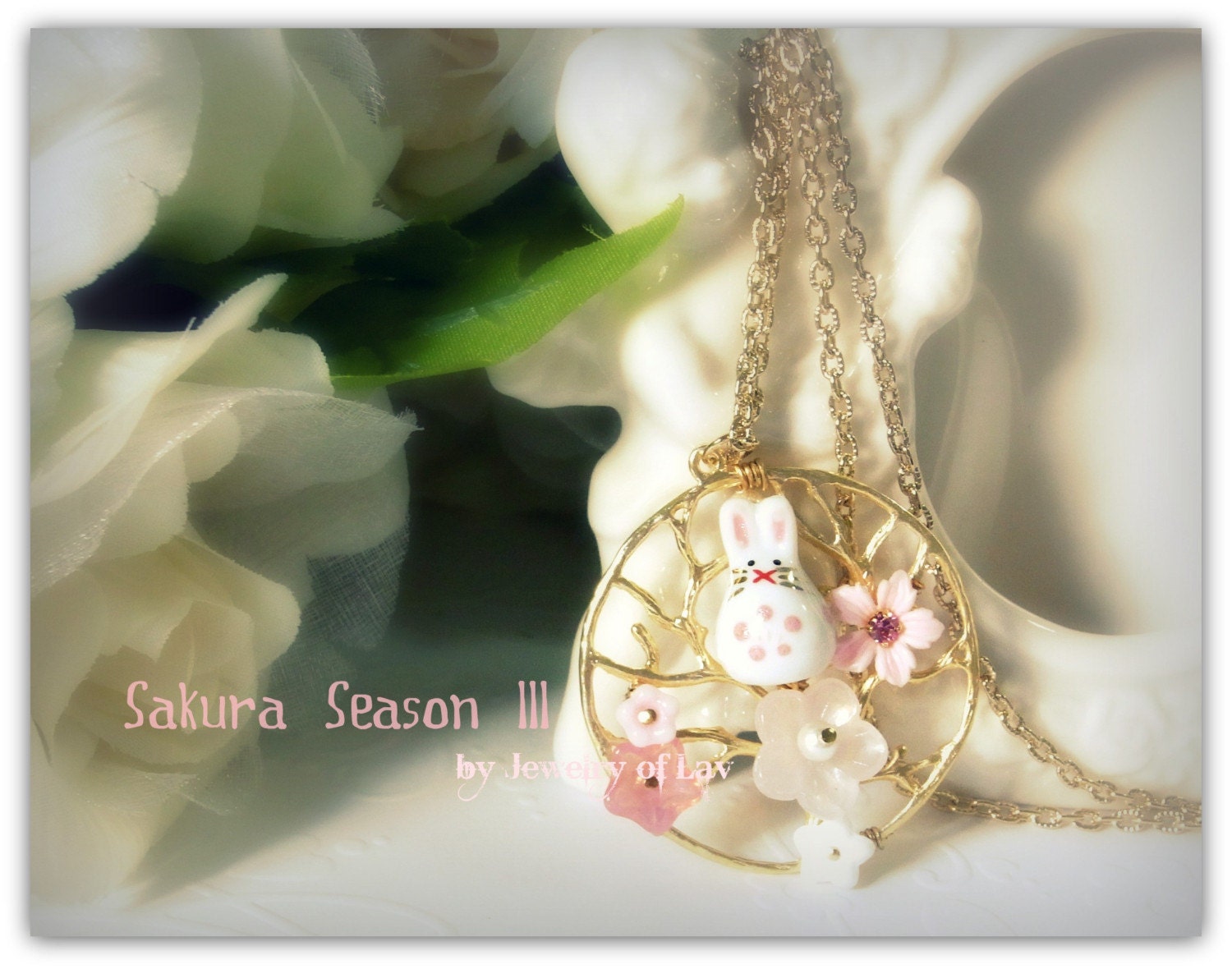 Sakura Season III Necklace made with pretty flowers, swarovski pearls, a cute porcelain bunny rabbit etc.