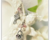 Unlock My Heart earring made with silver lock charm, silver key charm, swarovski crystals, swarovski pearls, 925 silver ear hooks etc.
