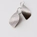 Handmade sterling silver earrings with a streamlined yet unique outer leaf shape and a distinctive hammered pattern - "La Hoja Earrings"