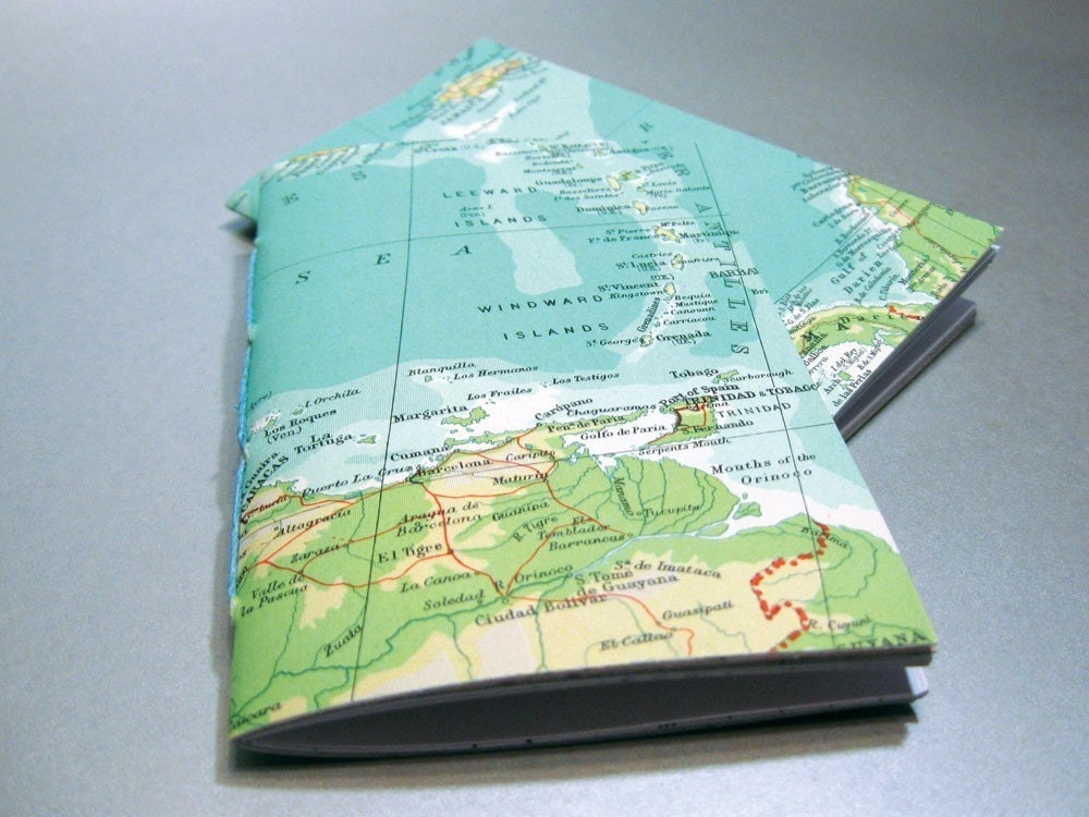 2 notebooks made with post-consumer, reused, rescued, and found papers