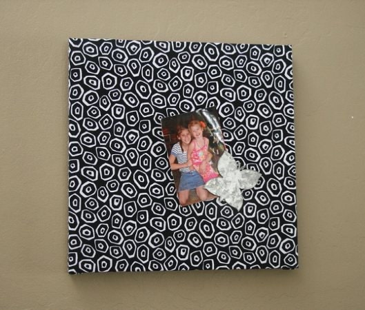 Fabric covered loose ends magnetic board