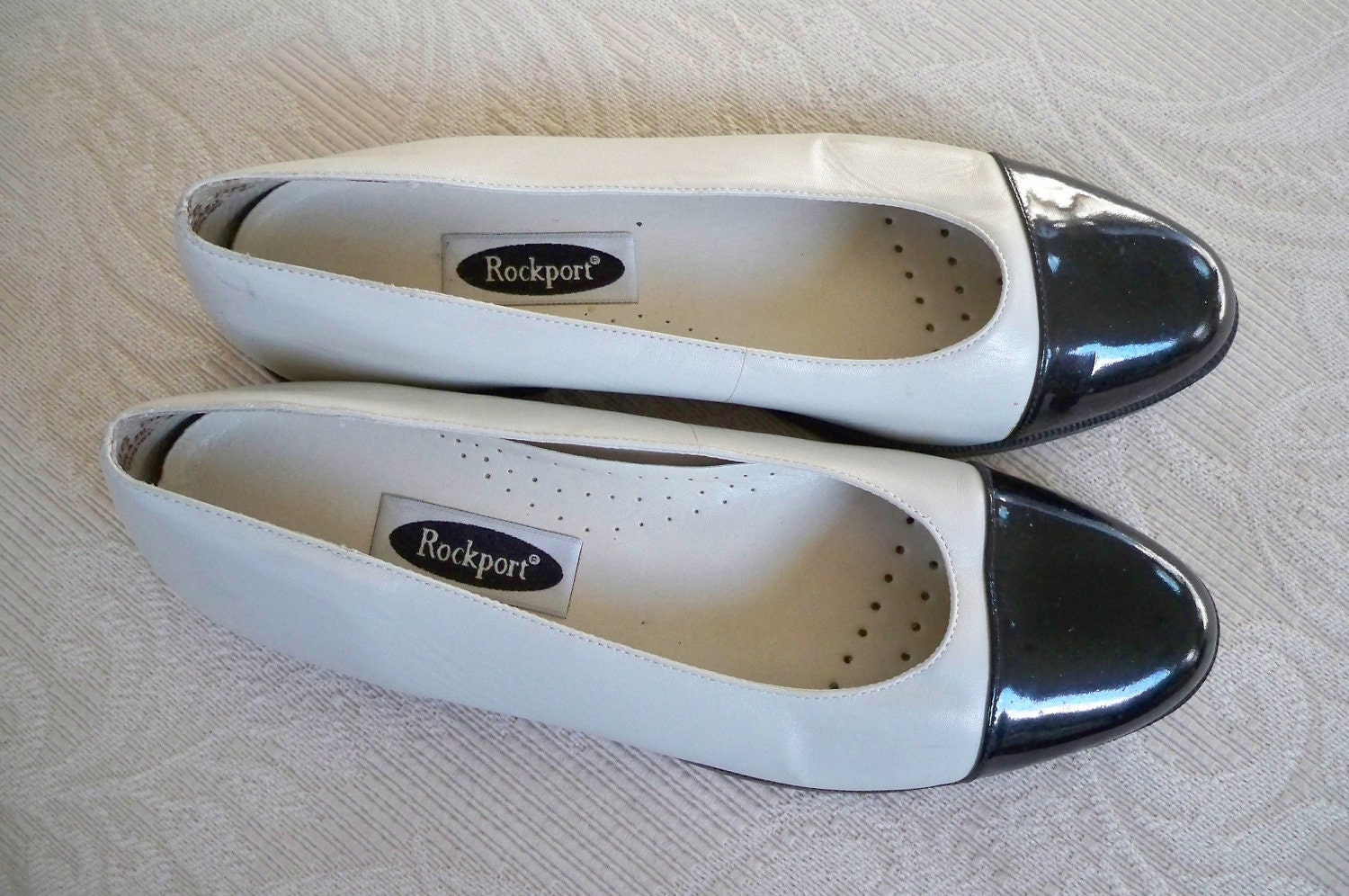 black and white spectator flats