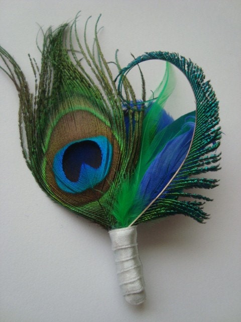 Weddings peacock boutonniere for the groom by eeek