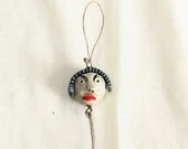 River -------- Ceramic Miniature on String.