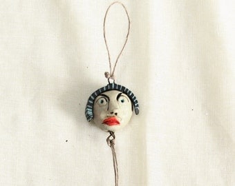 River -------- Ceramic Miniature on String.