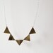 Bunting necklace in golden girl