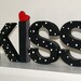 black and white kiss letters
