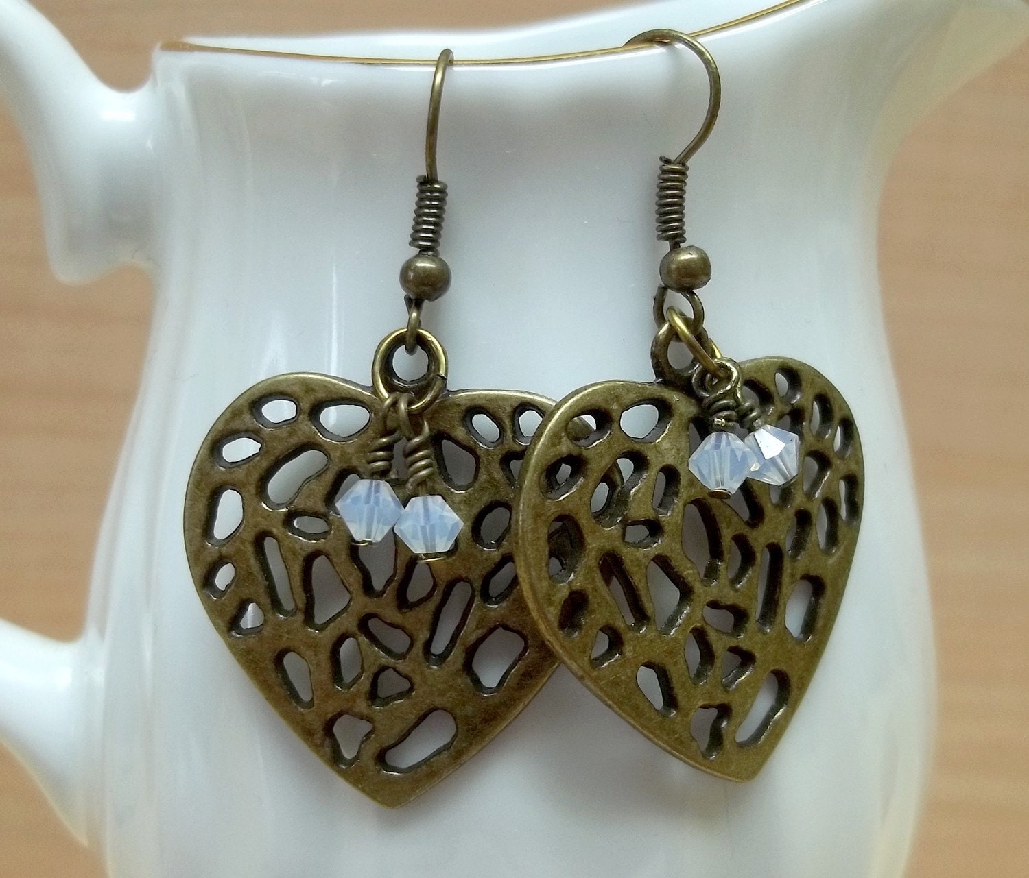 white swaroski crystal Antiqued brass heart earrings