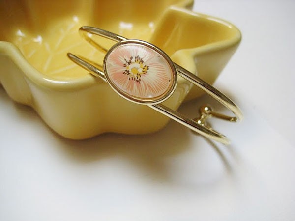 Gold tone Cuff bracelet with floral touch
