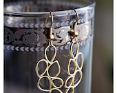 Gold  metalwork earrings .
