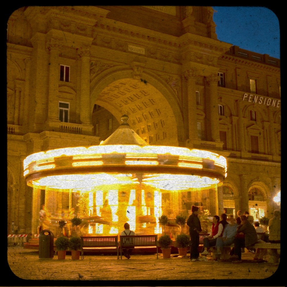 Photo of a carousel in Florence, Italy, carnival night evening Tuscany city merry-go-round classical architecture  Florentine Carousel