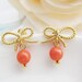 Matte gold finish Bow tie Ear posts and Bamboo coral beads . Gift for Her . Under 25