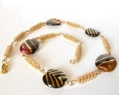 Bronze and black Kazuri bead gold coiled wire necklace