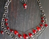 Multistrand Gunmetal and Red necklace