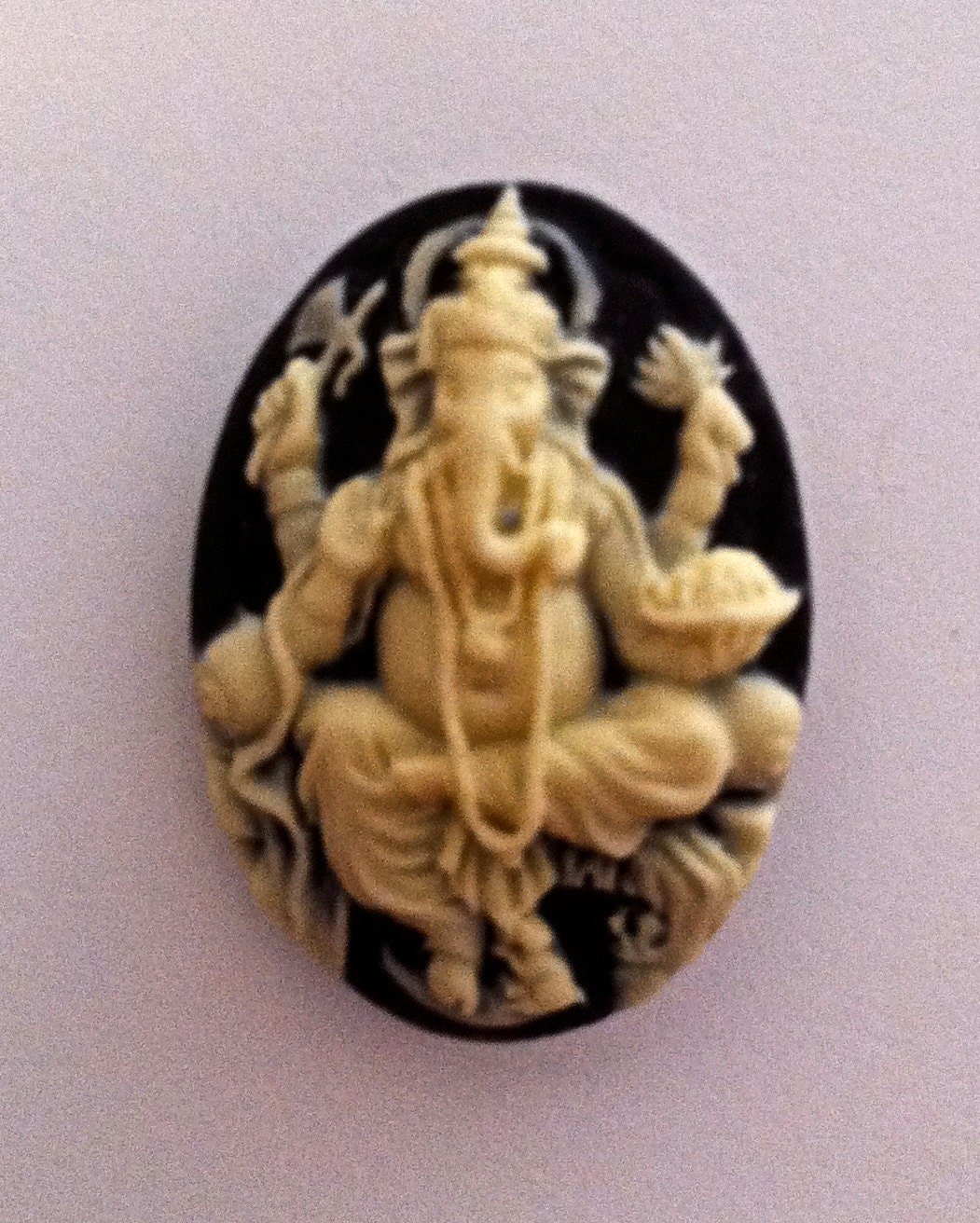 Ganesh Cameo 25x18mm, set of 4.  Ivory on Black