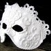 White, Black masquerade mask in ornate Venetian style , Domino