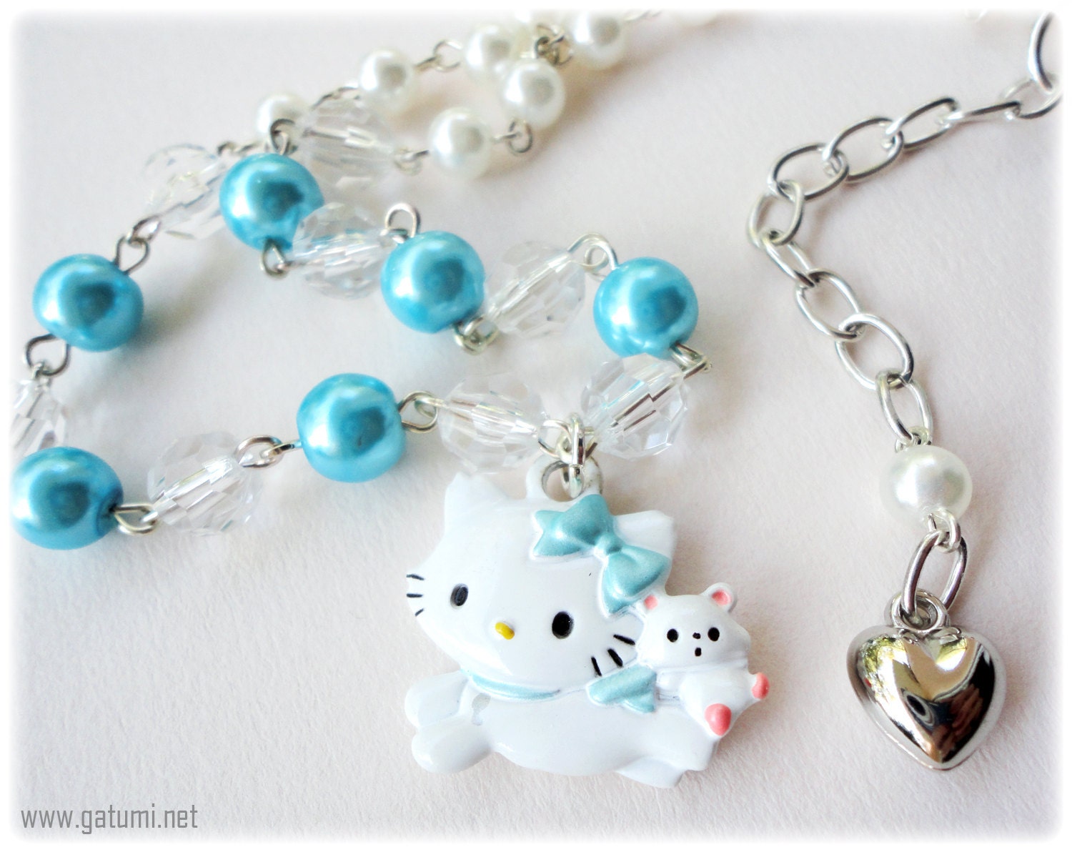 Charmmy Kitty Necklace with White and Teal Pearls in Silver