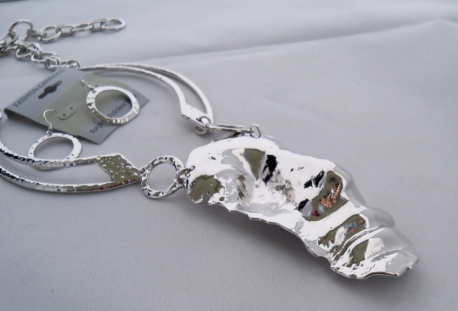 Statement set Inspired by Salvador Dali Half Face Man,Necklace, earrings, chocker Rhodium made by Shoptillyoudropnow on Etsy