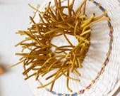Saffron urchin - hoop cotton and leather textile art