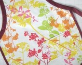 Wildflower student apron in pink, red, orange, yellow & lime