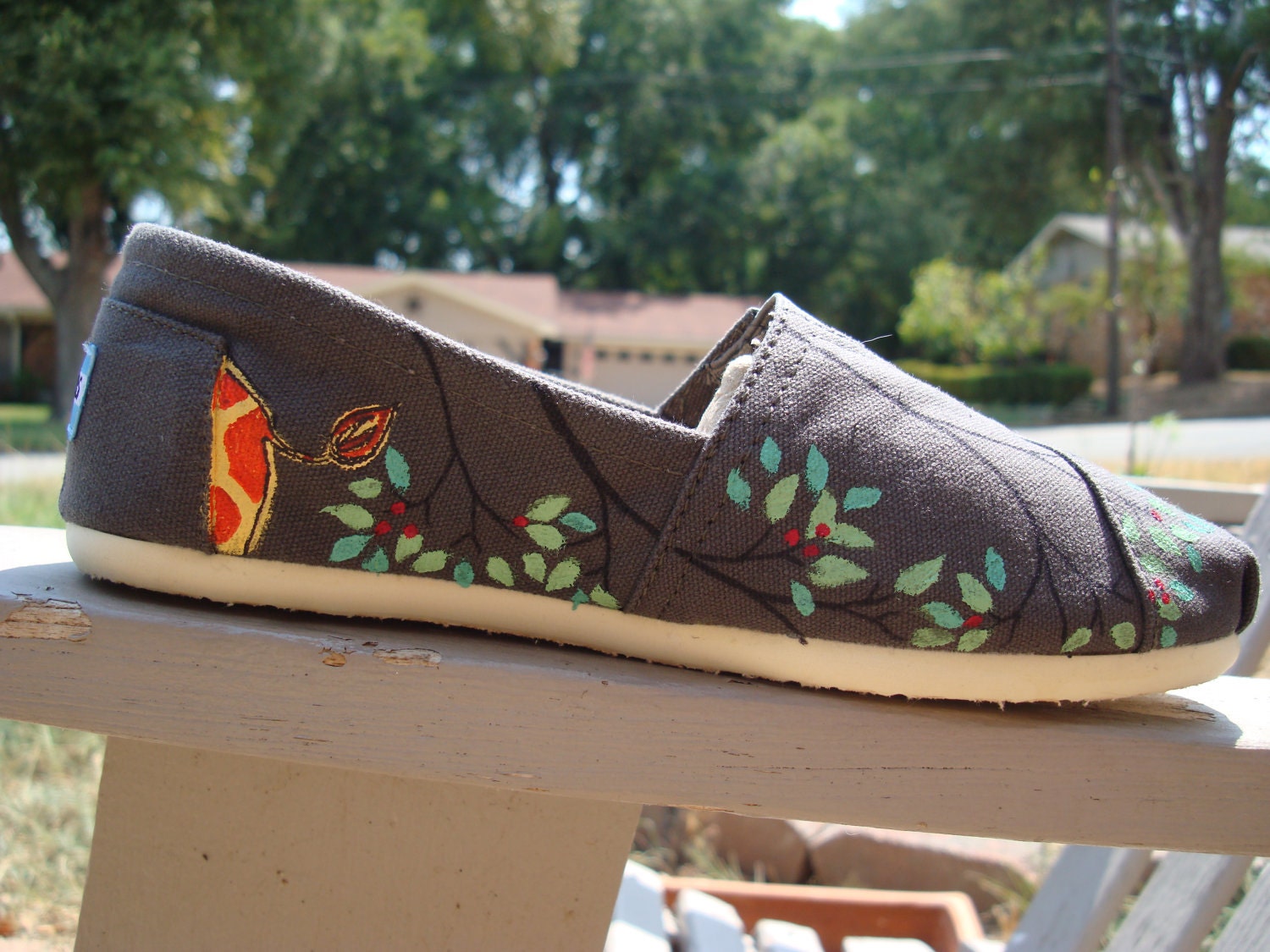 giraffes painted on TOMS shoes