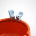 Yarn bowl knitting bowl ceramic Tangerine orange with kissing birds.