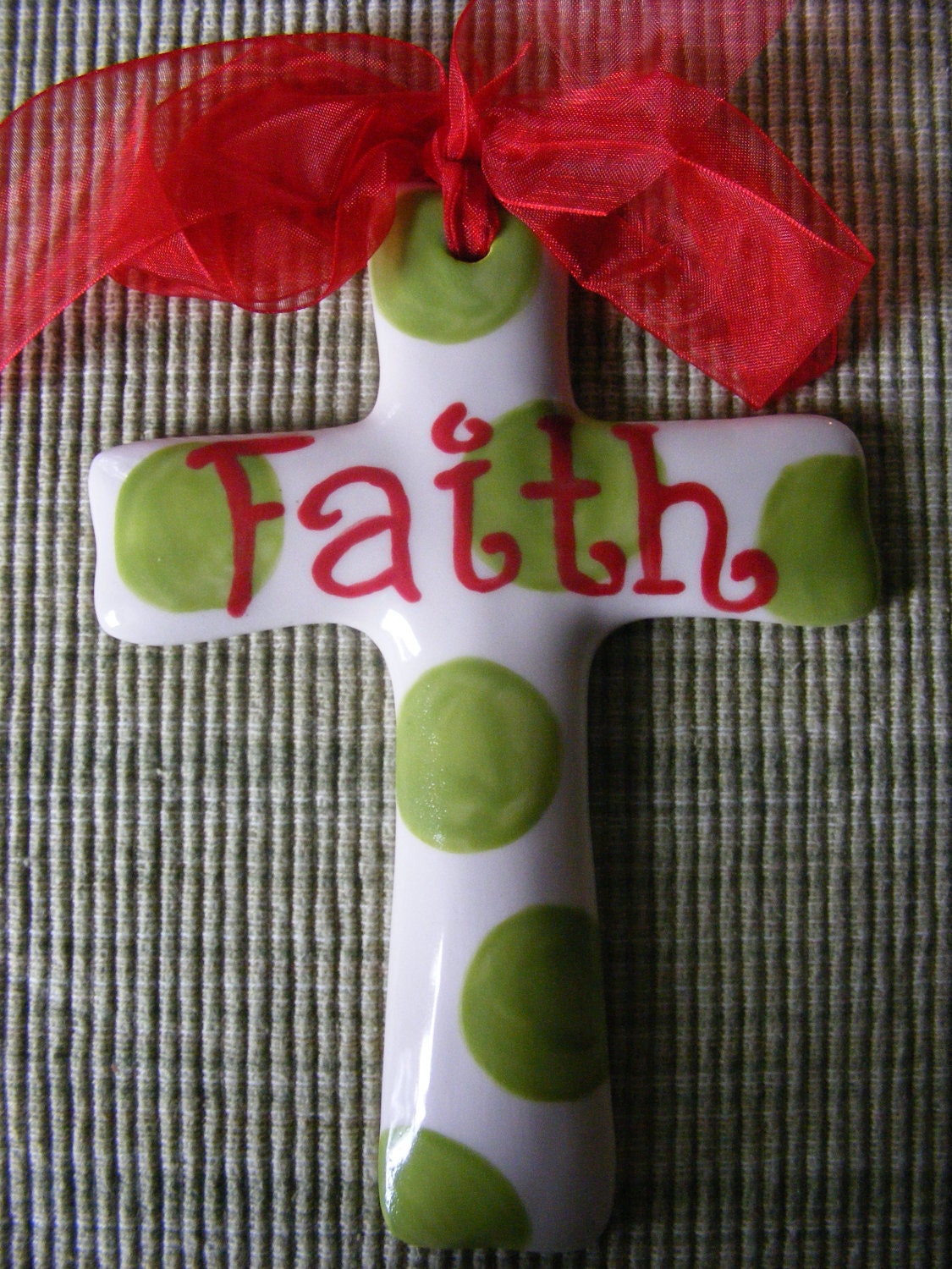 Handpainted Faith Ceramic Cross with Green Polka Dots and a Sheer Red Ribbon