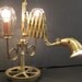 The Inventor's Lamp, a 3 way scissor arm table lamp