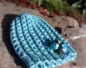 Blue babyhat with flower  silky decoration