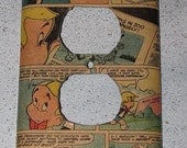 repurposed richie rich comic book page, made into an electrical outlet