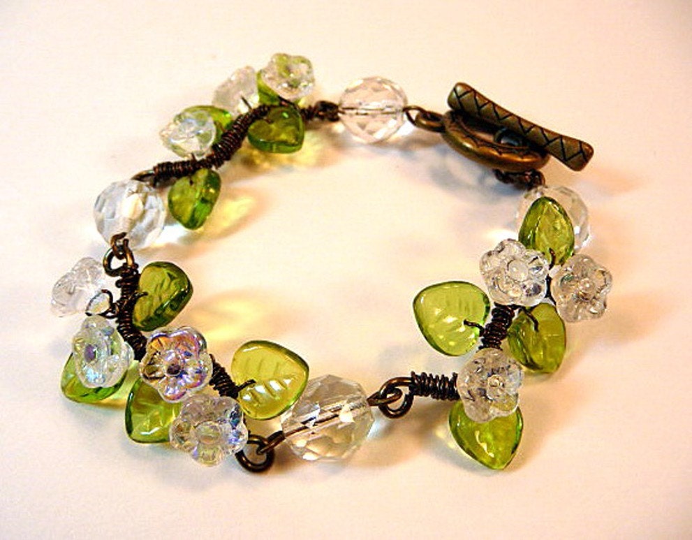 Bracelet - wire wrapped, floral, crystal clear flowers, green glass leaves, antiqued bronze