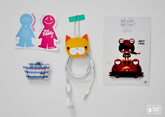 Yellow Kitty electric wire keeper and keychain.