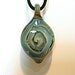 Handmade Glass Necklace. Flameworked Pendant with a Marine-Colored Twist.