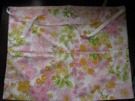 Vintage floral sheet apron.  Handmade from a vintage pillowcase in foral pink yellow green flowers.