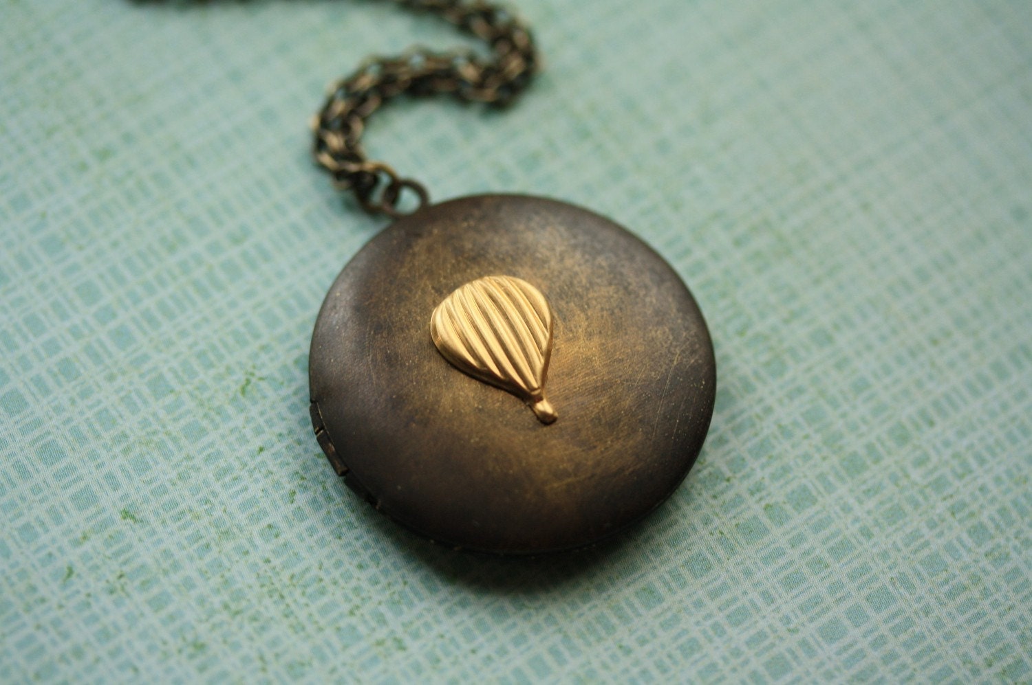 Little Golden Air Balloon on a Dark Brass Vintage Locket
